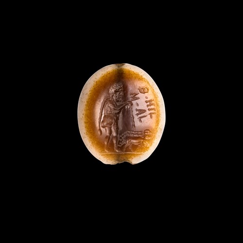 A Roman agate intaglio. Faustulus with inscriptions.